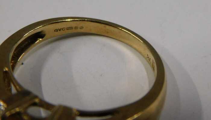 A QVC 9ct gold citrine and diamond dress ring, the rectangular cut ...