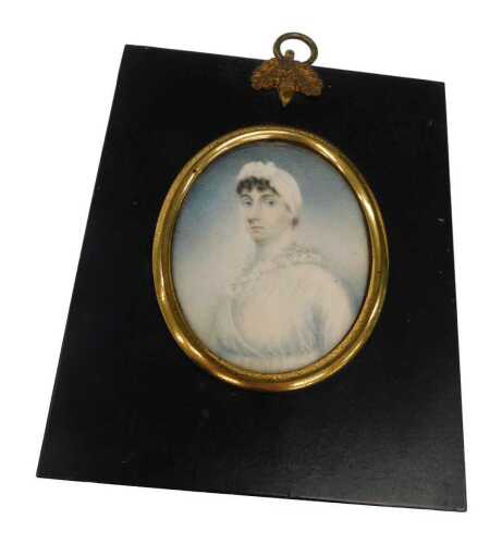 19thC English School. Portrait miniature of a lady wearing finery half profile, gouache on ivory,...