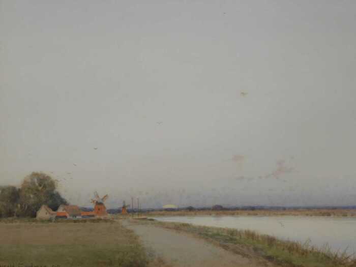 John Reginald Goodman (b.1878). Norfolk Broads, wetlands with windmills in the distance,...