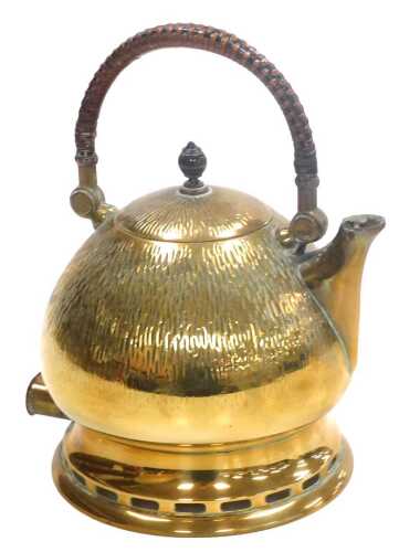 An early 20thC brass electric kettle, designed by Peter Behrens, with a hammered bulbous body,...