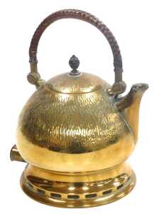 An early 20thC brass electric kettle, designed by Peter Behrens, with a hammered bulbous body,...