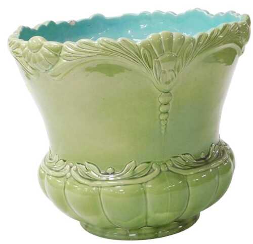 A late 19thC Continental Majolica jardiniere, of semi fluted form, moulded with mistletoe and...