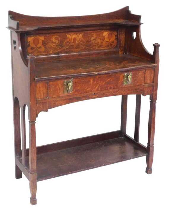 A Victorian Arts and Crafts oak buffet, by Shapland & Petter, Barnstaple, with a floral inlaid...