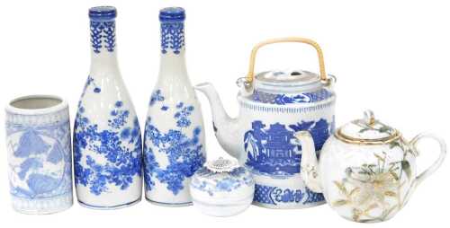 A pair of 20thC Japanese blue and white Arita porcelain sake bottles, decorated with flowers, 24....