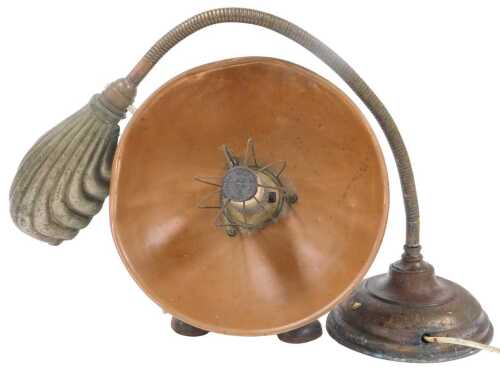 An early 20thC copper angular desk lamp, with a fluted shade, together with a Swan brand copper...