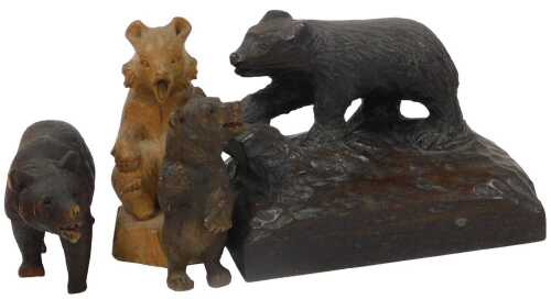 Four 19thC and later Black Forest and other carvings of bears, in standing and walking pose.