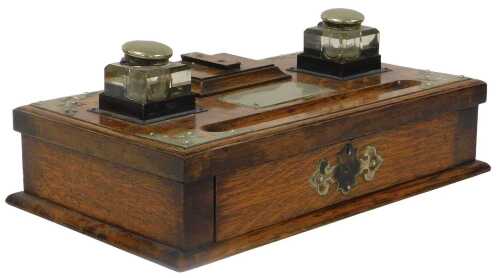 A Victorian oak deskstand, with plated mounts, of rectangular section, with two cut glass...