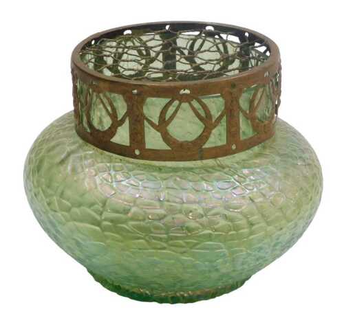 An early 20thC Kralik Art Nouveau green iridescent glass bowl, with a pierced metal and mesh lid,...