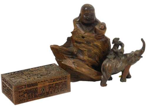 A early 20thC Chinese root foot carving of Buddha, 27cm high, together with a hardwood carving...