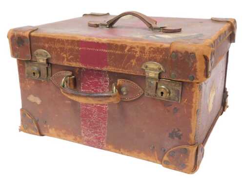 An early 20thC leather travelling case, by C. Maude, Bag & Suitcase Maker, Leeds, with a green...