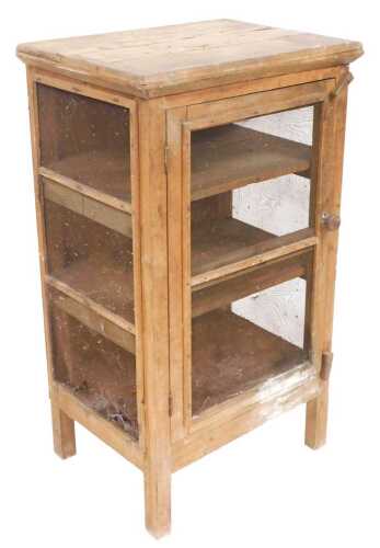 A 19thC pine meat safe, the pediment over a door with a metal grille front, enclosing two...