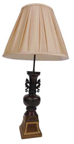 A Japanese Meiji period bronze twin handled vase, converted to a table lamp, with a gilt tooled...