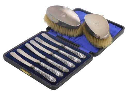 A pair of Edward VIII silver backed hairbrushes, with engine turned decoration, circular...