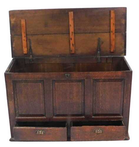 A 18thC oak mule chest, with a triple panelled front and two frieze drawers with later cup...