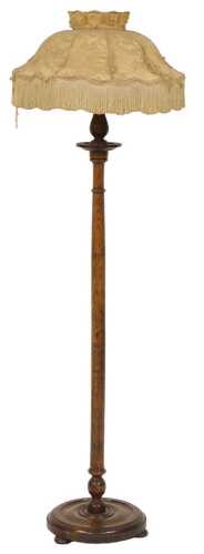 A early 20thC Victorian oak standard lamp, with a turned column, and a cream silk shade, raised...