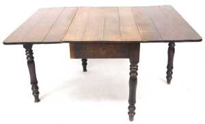 A late Georgian oak drop leaf dining table, raised on turned legs, 71cm high, 106.5cm wide,... - 2