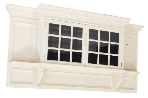 An Edwardian white painted mahogany ovalmantel cupboard, with a stepped pediment, over a pair of...