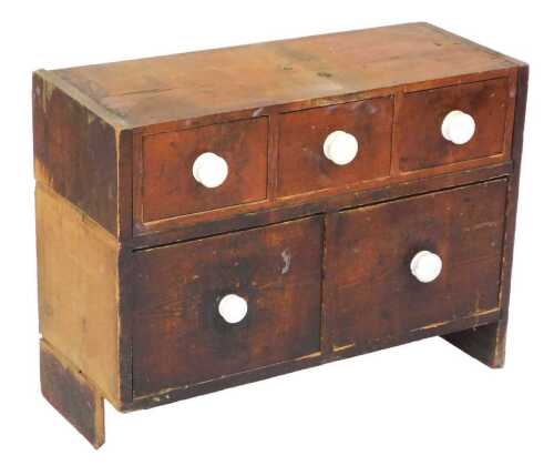 A Victorian pine chest, of three short over two deep drawers, 50cm high, 67cm wide, 26.5cm deep.