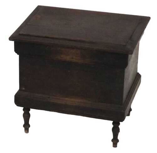 A Victorian oak commode, the hinged lid opening to reveal a vacant interior, raised on turned...