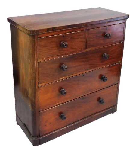 A Victorian mahogany chest, of two short over three long graduated drawers, raised on a plinth...