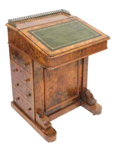 A Victorian walnut Davenport, with a brass gallery and gilt tooled green leather slope, opening...