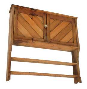 A Victorian pine hanging wall shelf, with three shelves, above a pair of cupboard doors...