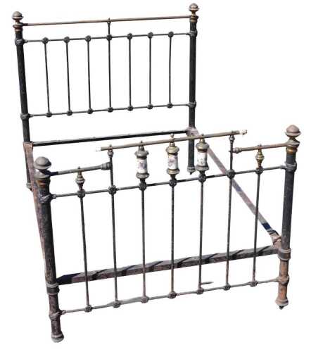 Reds (1981) movie interest, a Victorian black painted and brass double bed, the headboard inset...
