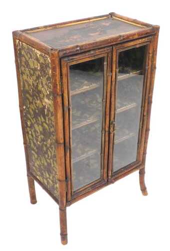 A Victorian bamboo display cabinet, with a lacquered top, decorated with birds and blossom,...