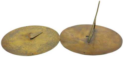 An engraved brass sundial, stamped Sine Umbra Nihil, 21cm diameter, and another brass sundial,...