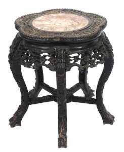 A late 19thC Chinese hardwood urn stand, with a cinquefoil top carved with flowers and bamboo,...