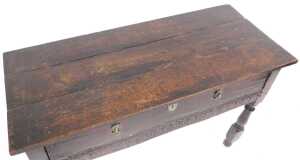 A 17thC oak serving table, with a triple plank top, above one long drawer over a frieze carved... - 2