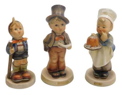 Three Hummel figures, comprising Baker, Street Singer, and Little Hiker. (AF)