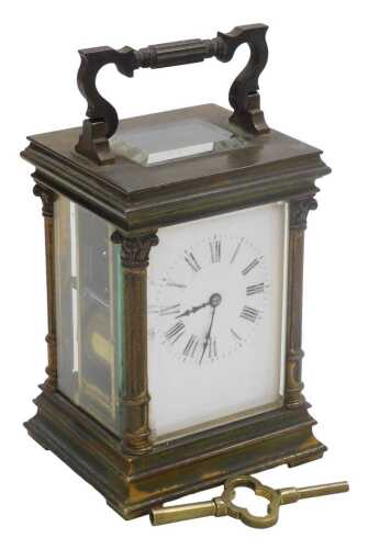 A late 19thC French brass carriage clock, rectangular enamel dial bearing Roman numerals, eight...