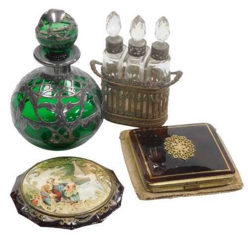 A late 19thC green glass scent bottle and stopper, with silver floral overlay, (AF), a French...