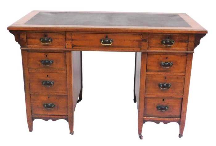 A Victorian mahogany twin pedestal desk, the top inset with brown leatherette, above one long...