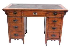 A Victorian mahogany twin pedestal desk, the top inset with brown leatherette, above one long...