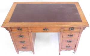 A Victorian mahogany twin pedestal desk, the top inset with brown leatherette, above one long... - 2