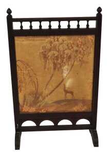 A Victorian mahogany framed fire screen, set with a silk panel, decorated with a deer in a...