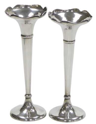 A pair of George V loaded silver bud vases, of trumpet form, Mappin and Webb, Birmingham 1915, 7....