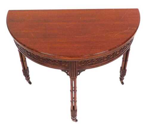 A Chippendale Revival mahogany demi lune foldover card table, with a green baize interior, above...