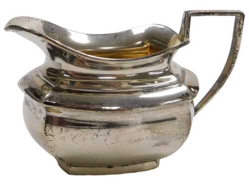 An Edward VII silver cream jug, with an angular handle, Birmingham 1907, 2.82oz.