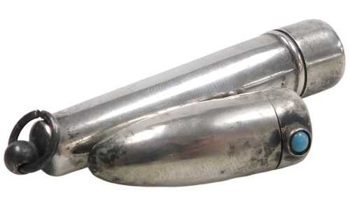 A George V silver cigarette holder, with a silver outer case, Birmingham 1918, and a silver...