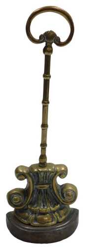 A 19thC cast brass doorstop, decorated with a lotus flower and scrolls, and a knopped handle,...