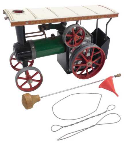 A Mamod model of a steam tractor, TE1A, in green, black and red livery, with a cream roof, 30cm...