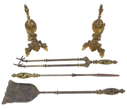A pair of 19thC Continental gilt brass fire dogs, decorated with scrolls, etc., 43cm high, and a...