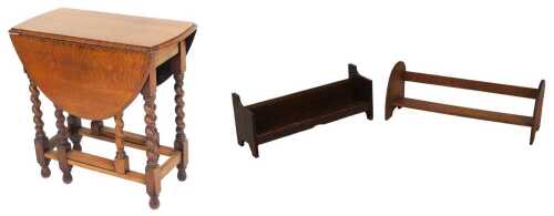 Two early 20thC oak book troughs, 72.5cm and 64cm wide, together with an early 20thC oak drop...