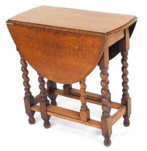 Two early 20thC oak book troughs, 72.5cm and 64cm wide, together with an early 20thC oak drop... - 2