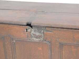 An 17thC oak coffer, with a two plank top, above a triple panelled front, raised on stiles, 65cm... - 2
