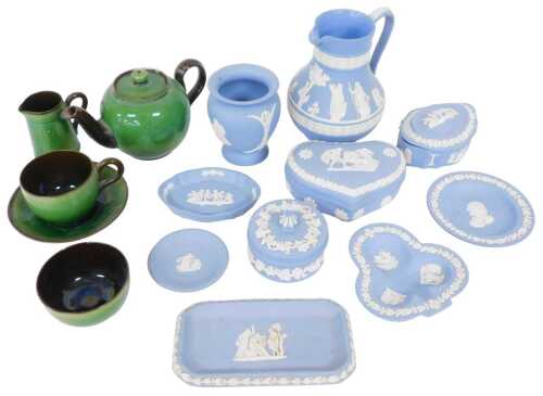 A Watcombe pottery tea for one, with a green and brown glaze, and various items of pale blue...