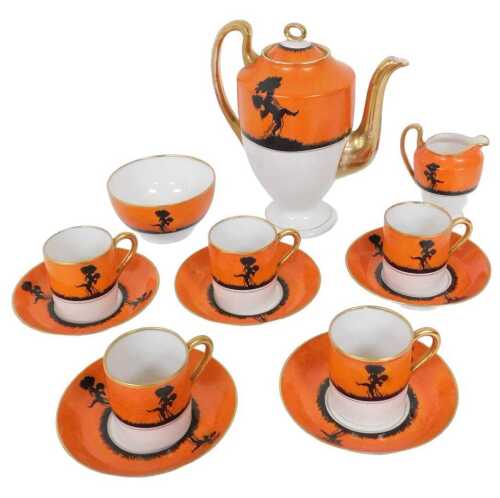 An early 20thC Continental porcelain part coffee service, each piece decorated with a black...